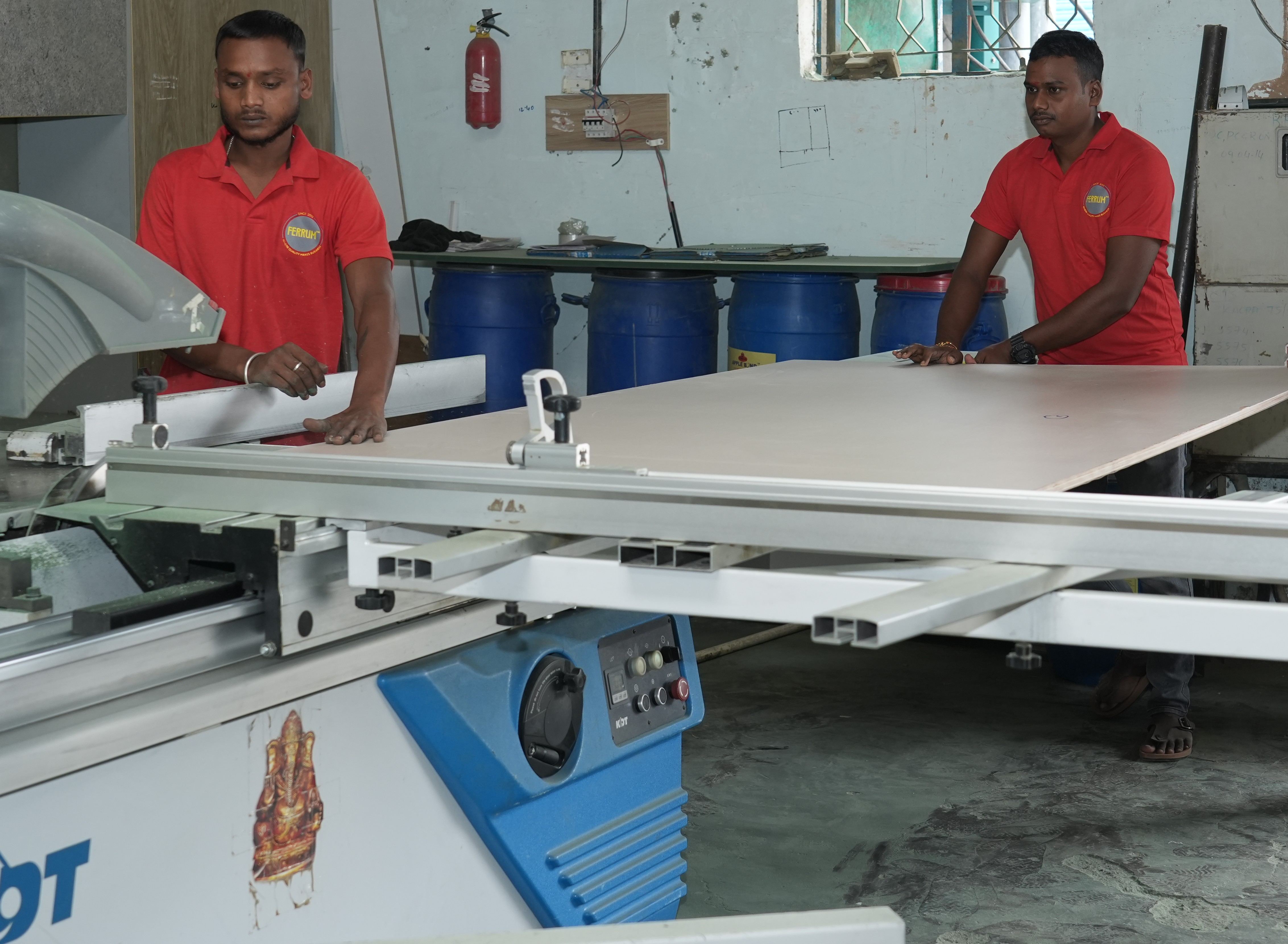 Craftsman working on precision panel machinery